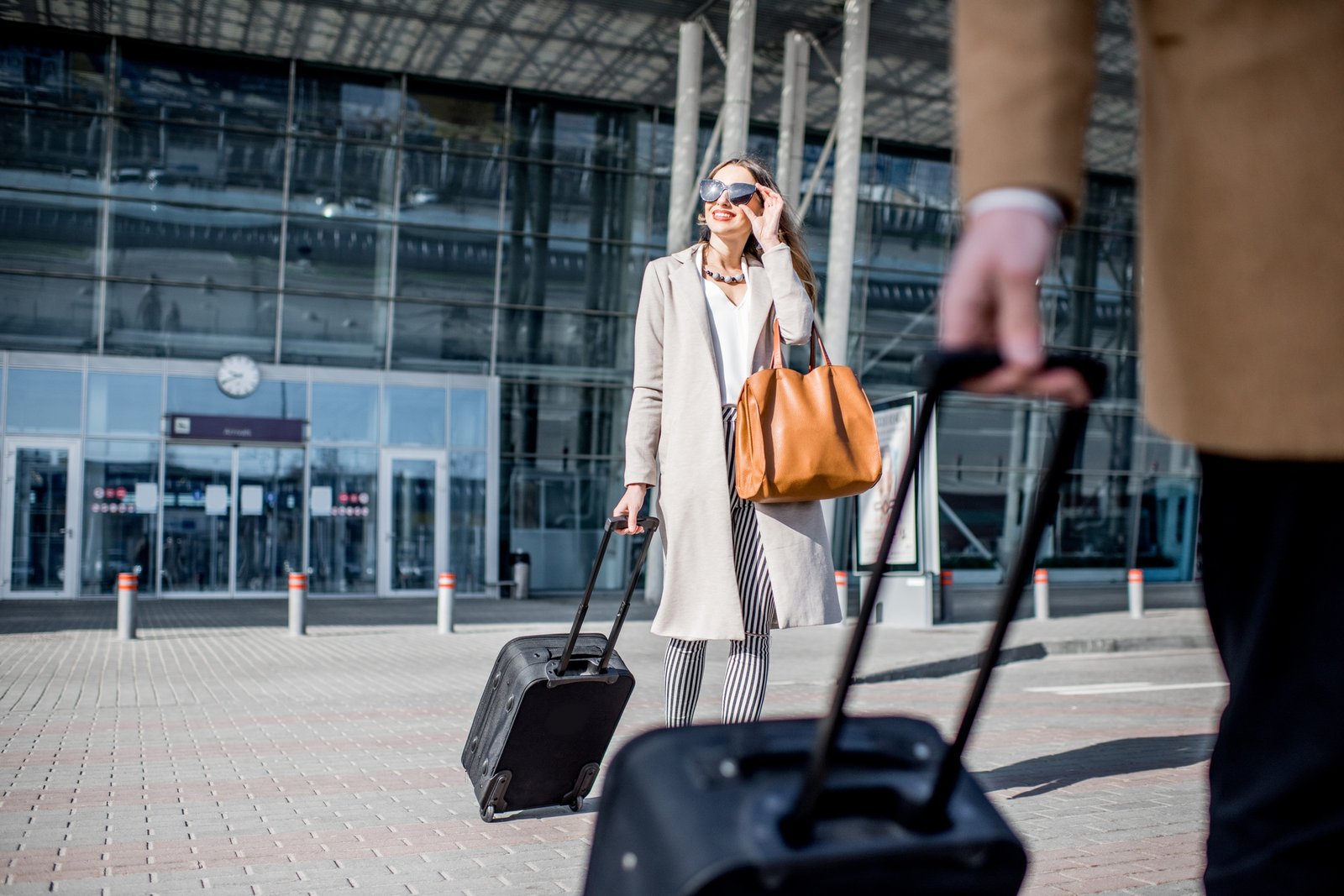 Business couple leaving the airport